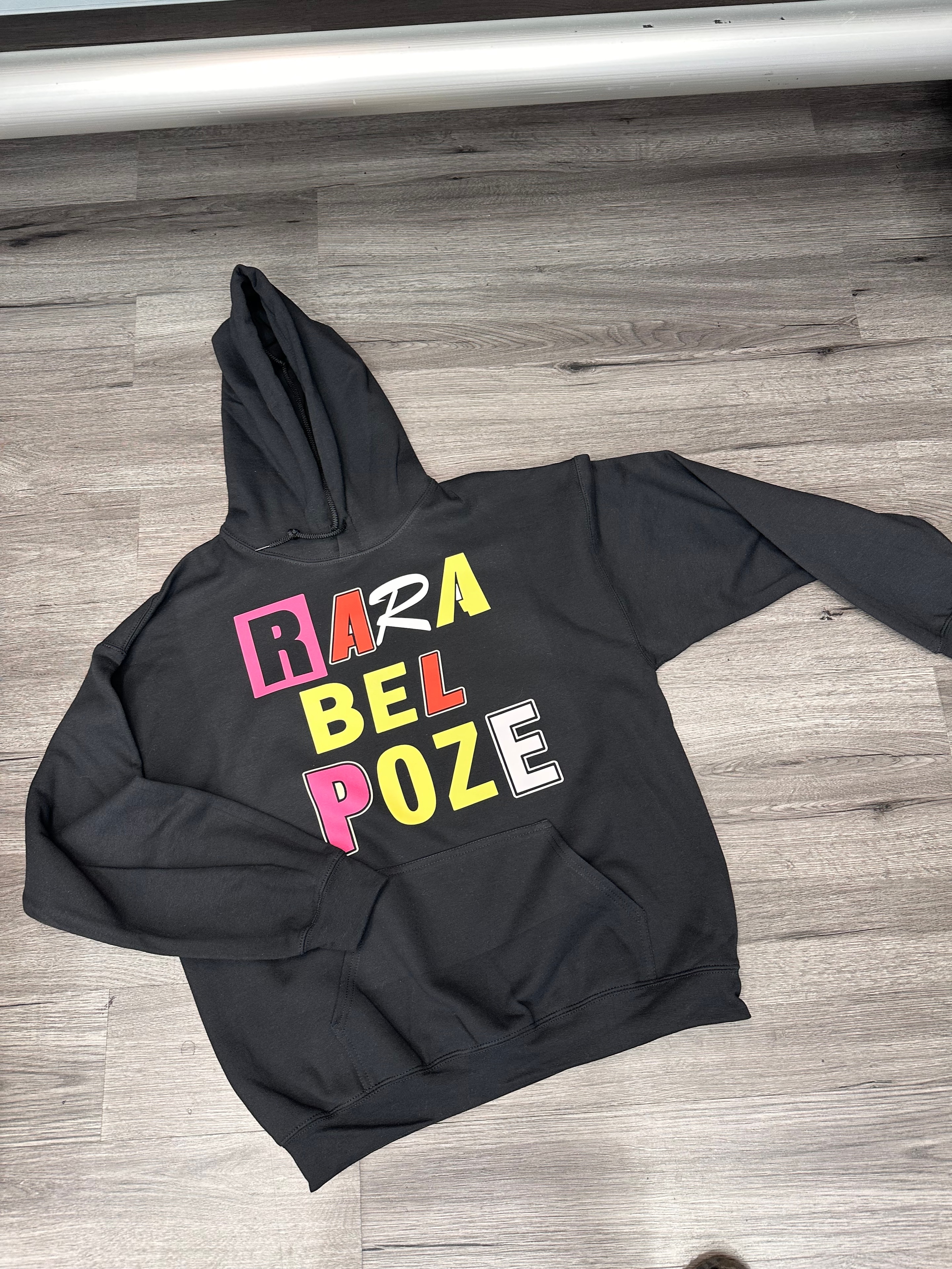 Rara Bel Poze hoodie — bold multicolored branding on black